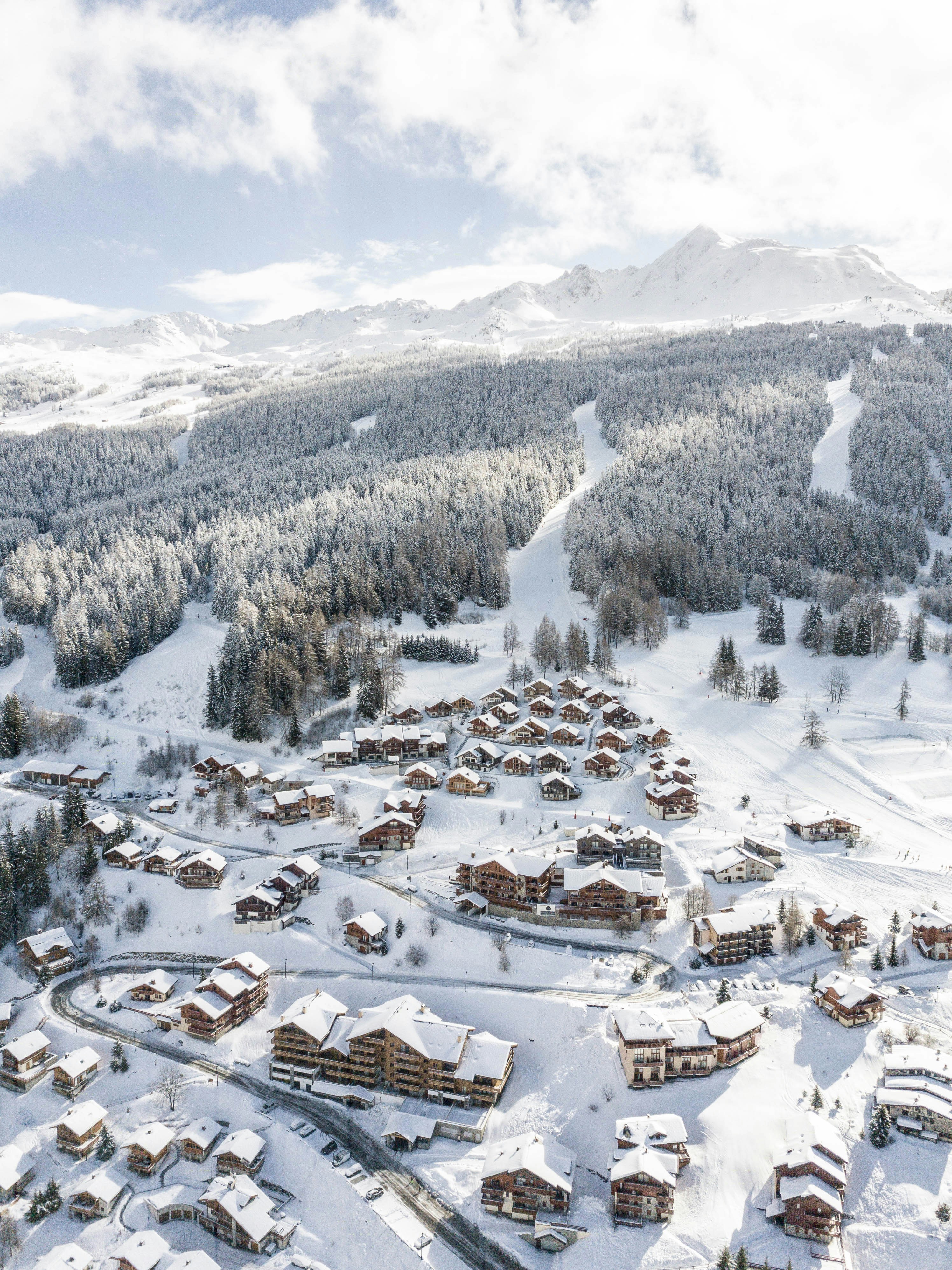 Aerial view of Les Arcs ski resort villages and pistes in the Tarentaise Valley, French Alps
